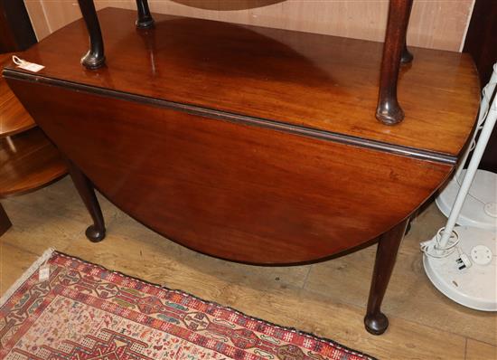 A George III mahogany drop leaf pad foot dining table W.126cm